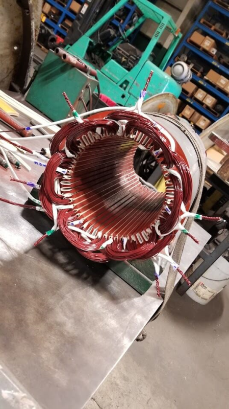 Experienced technicians repairing AC 3-phase motors