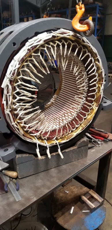 Skilled technicians performing AC 3-phase motor repairs